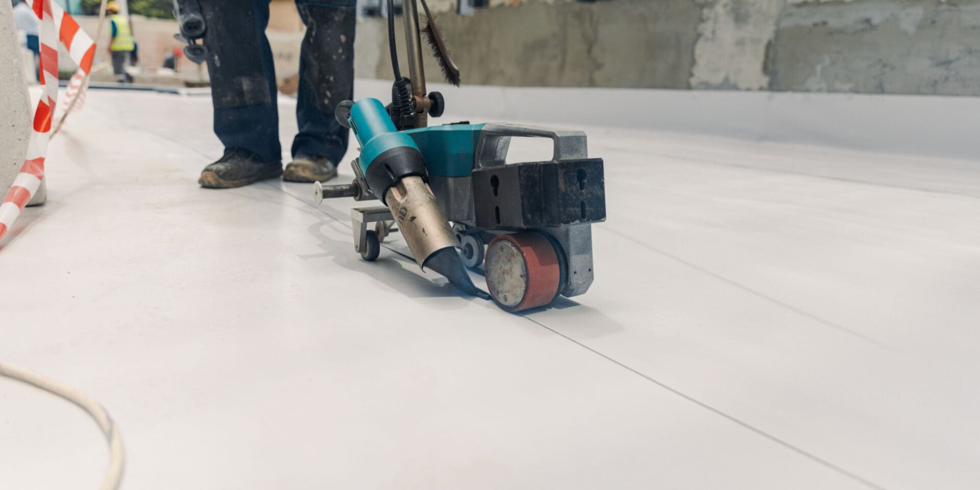Close up of roofer working on commercial roof